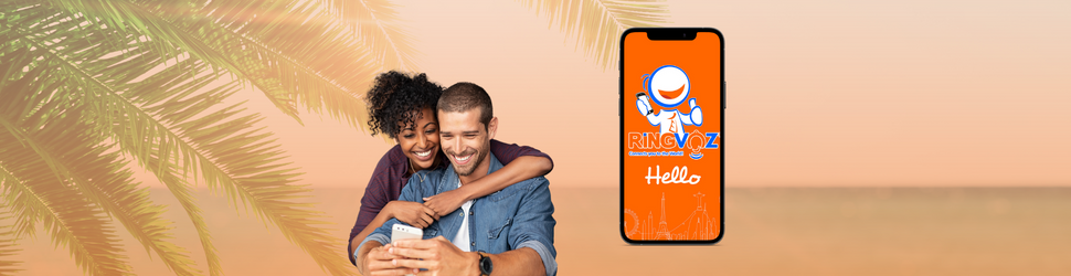 Couple talking about RingVoz Mobile App in the beach